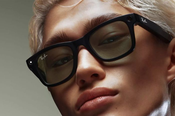 A close-up view of an individual wearing the Ray-Ban Meta Wayfarer Smart Glasses.