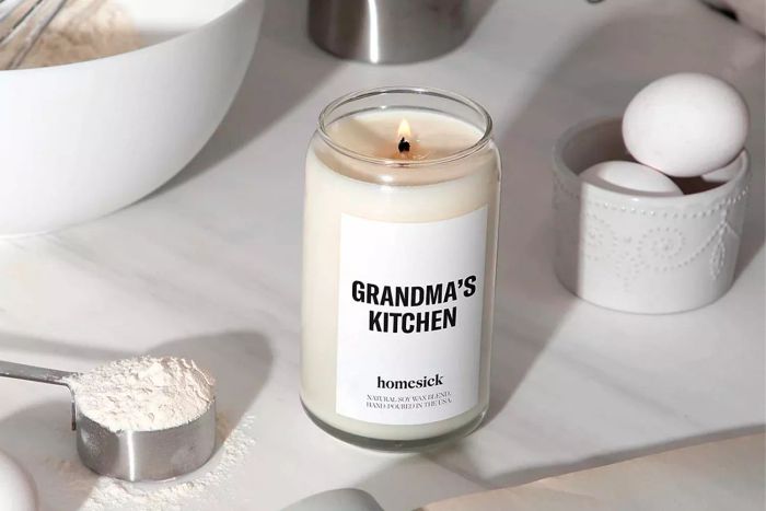Homesick Premium Scented Candle, Grandma's Kitchen displayed on a kitchen counter.