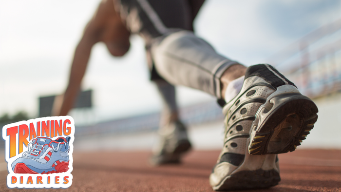 A focused runner poised at the starting line