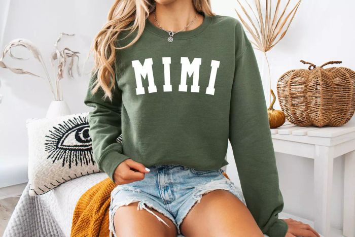 A person modeling the Mary and David Shop Mimi Grandma Sweatshirt.