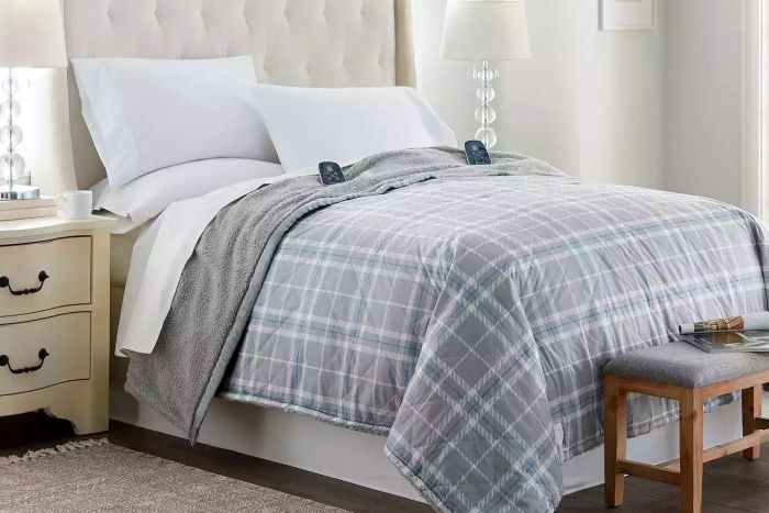 Shavel Home Products Micro Flannel Extra Weight Electric Blanket laid out on a bed.