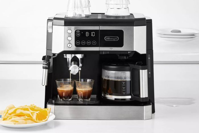 Here’s a close-up shot of the De'Longhi All-in-One Coffee and Espresso Maker COM532M in action, brewing a rich shot of espresso into a glass.