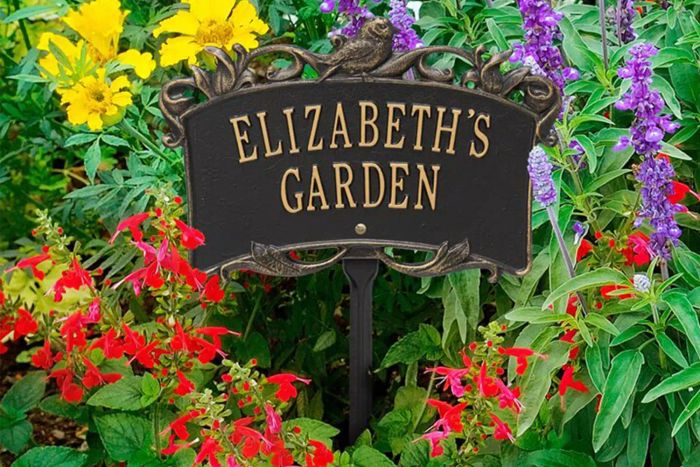 Whitehall Products Song Bird Custom Garden Sign displayed in a garden.