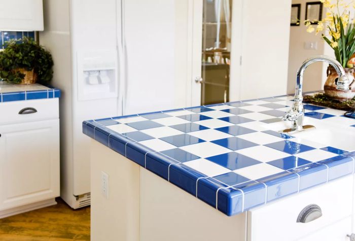 kitchen island with checkered white and blue tile