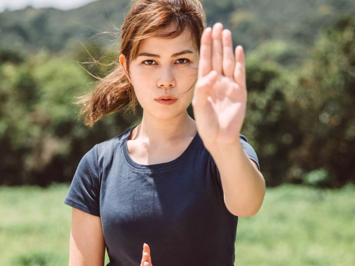 Fundamental Self-Defense Techniques Every Woman Should Learn: Woman demonstrating the moves