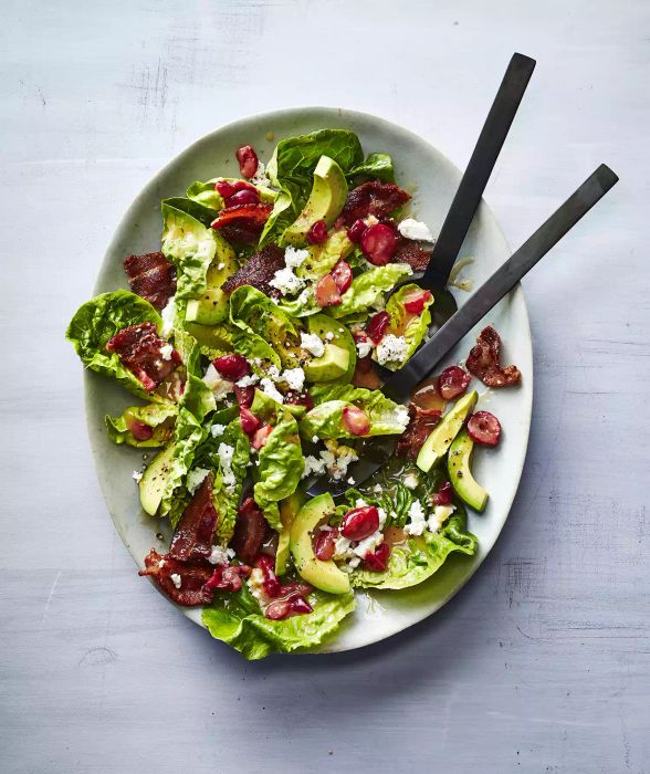 A gem lettuce salad topped with a drizzle of sour cherry vinaigrette.