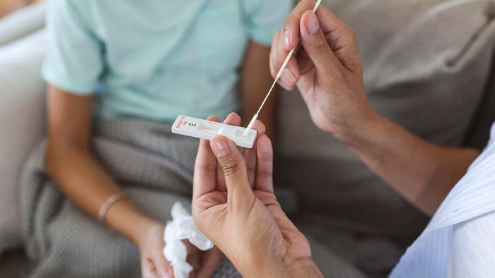 How to Respond If You Show COVID Symptoms but Your At-Home Test Shows Negative