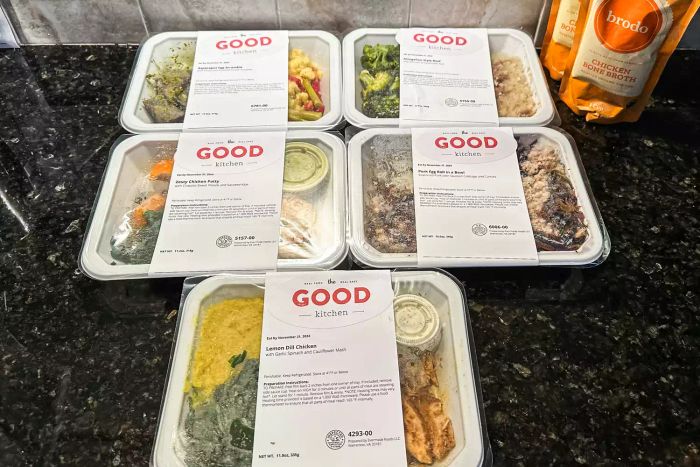 An assortment of The Good Kitchen meals displayed on a kitchen counter