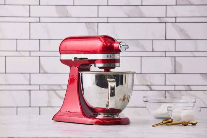 KitchenAid Artisan Mini -Quart Tilt-Head Stand Mixer displayed on a countertop with various ingredients around it