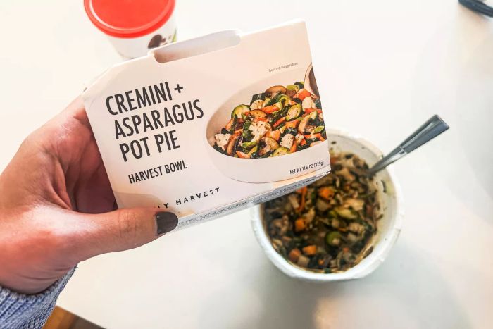 A person holding up one of the harvest bowls from the Daily Harvest Meal Kit