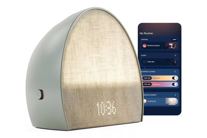 Hatch Restore 2, a sleek Sunrise Alarm Clock and Sound Machine, offers a smart light and customizable routines to enhance your sleep. Experience gentle unwinding and wake up refreshed with its dimmable clock and white noise features. Perfect for adults seeking a better night's rest.