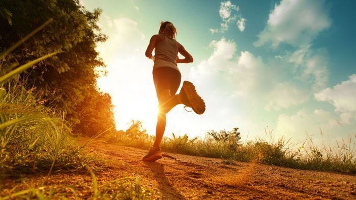 A runner silhouetted against the horizon—is it dawn or dusk?
