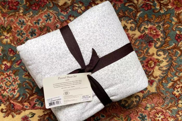 The Laura Ashley Home Collection Premium Ultra Soft Cotton Flannel Sheets neatly folded