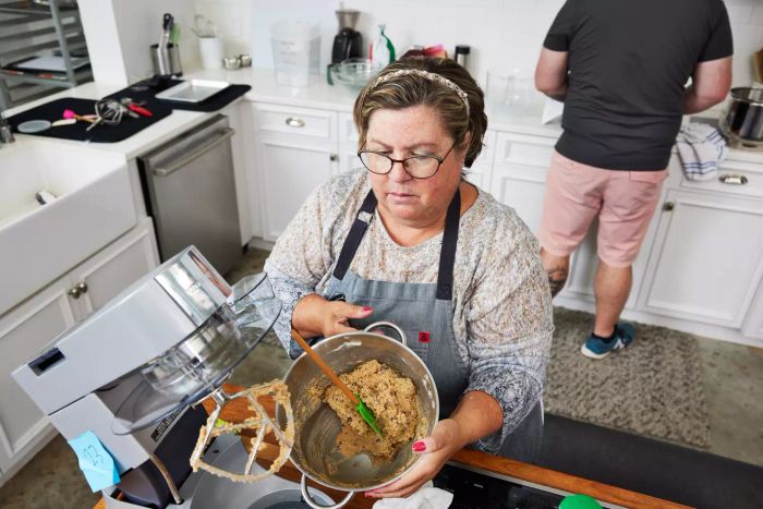 A person testing one of the stand mixers we recommend.