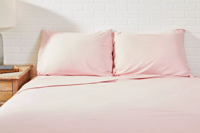 Bed adorned with the pink Lands’ End Comfy Super Soft Cotton Flannel Sheet Set