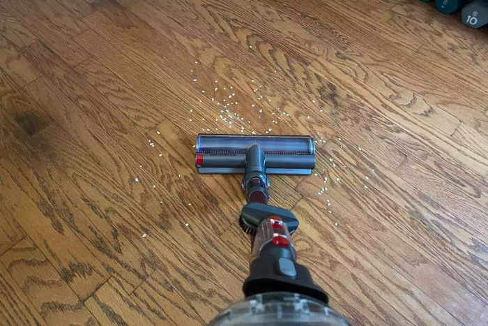 The Dyson Outsize+ Cordless Vacuum in action, cleaning a hardwood floor
