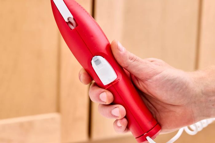 The button for dispensing the product from the wand of the Ortho Home Defense Insect Killer