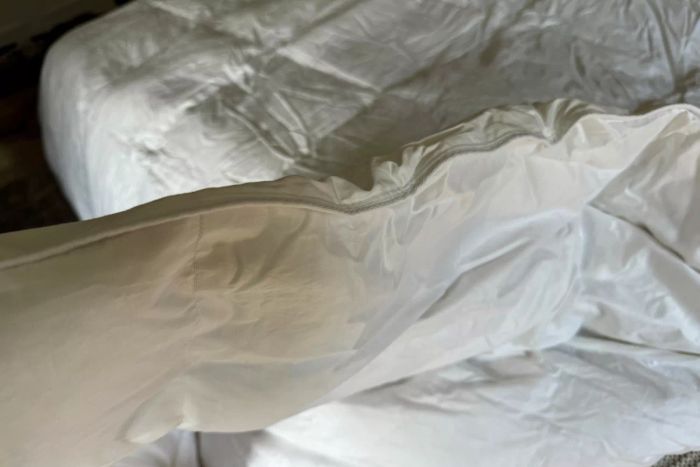 The luxurious thickness of the Quince Ultra Warm Luxe Goose Down Comforter.