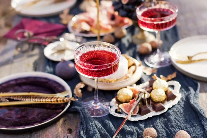 A glass of red wine placed on an outdoor table