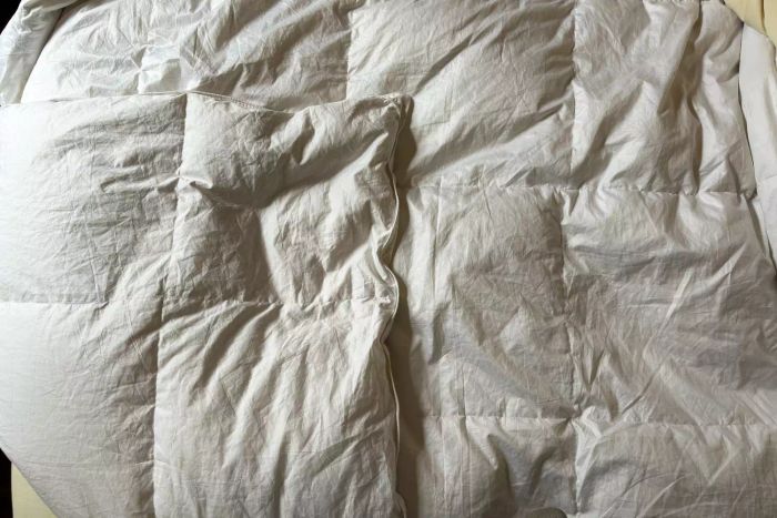 The Avocado Down Duvet Insert neatly folded over