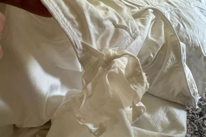 The corner ties on the Quince Ultra Warm Luxe Goose Down Comforter.