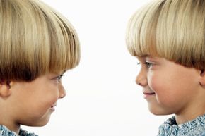 Two twin boys gazing at each other