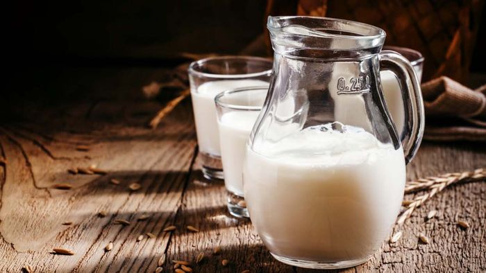 A pitcher filled with milk