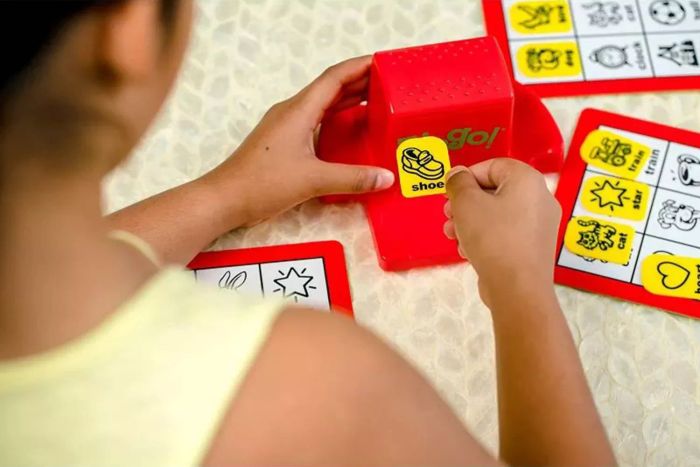 A detailed view of a child enjoying the ThinkFun Zingo game, engaged in play.