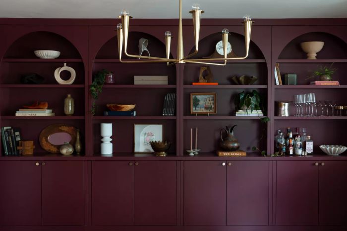 Dining room cabinets painted in a deep berry shade.