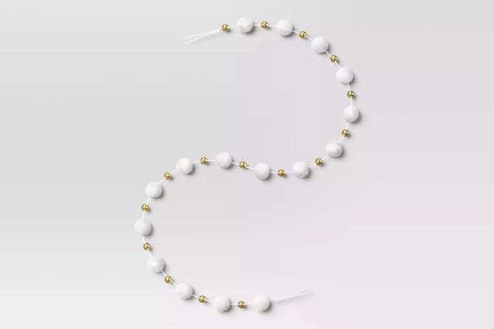 The Wondershop Pom Pom and Bead Christmas Tree Garland is a festive and playful decoration, perfect for adding a touch of whimsy to your holiday decor.