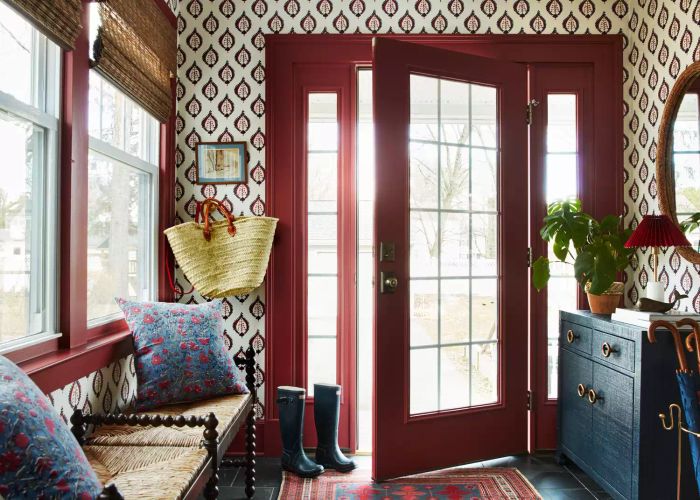 Walls in an entryway painted with Eating Room Red by Farrow & Ball.