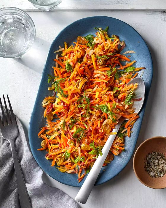 Garlicky, cumin-infused oil elevates the flavor of this Spiced Carrot Salad recipe.