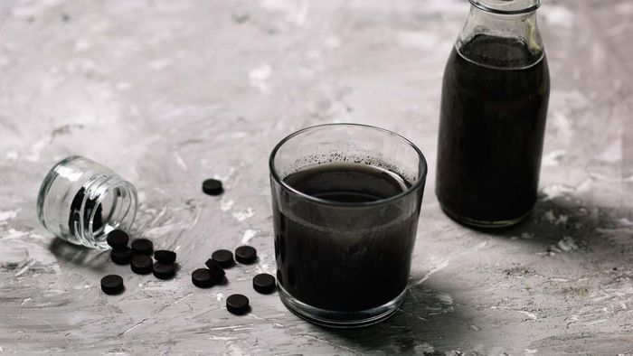 Activated charcoal is a substance known for its ability to absorb certain toxins from the digestive system. It is commonly administered in emergency rooms when someone has ingested a harmful substance. However, it does not work for alcohol, so mixing it with your drink will not help prevent a hangover, nor will it be beneficial once you wake up with an empty stomach the next morning.