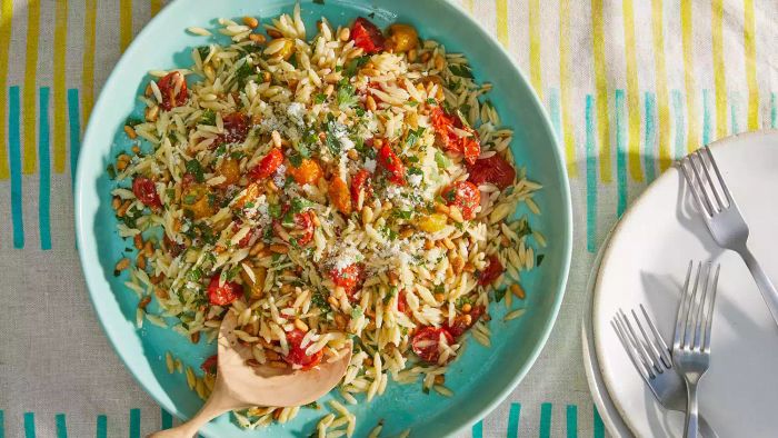 Orzo Tomato Salad Recipe: This simple yet flavorful salad combines the mild chewiness of orzo with the burst of freshness from tomatoes, ideal for any meal.