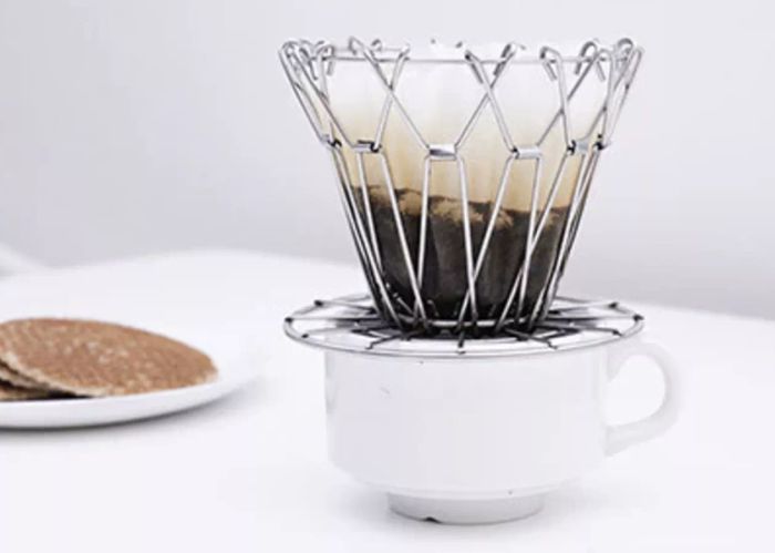 A coffee dripper positioned over a cup