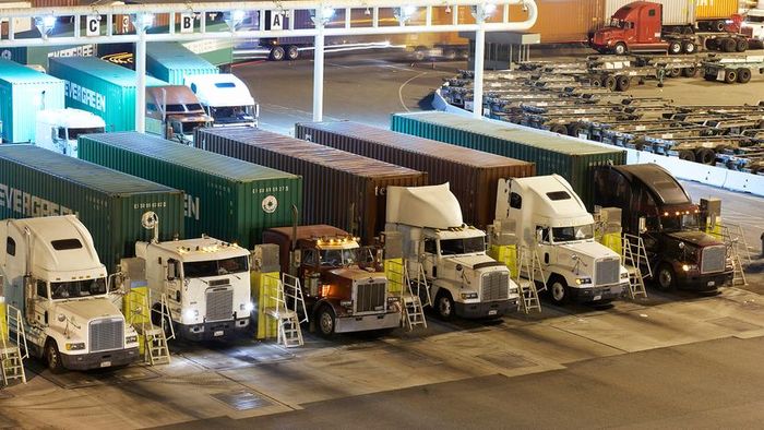 Freight trucks queued at a safety inspection point