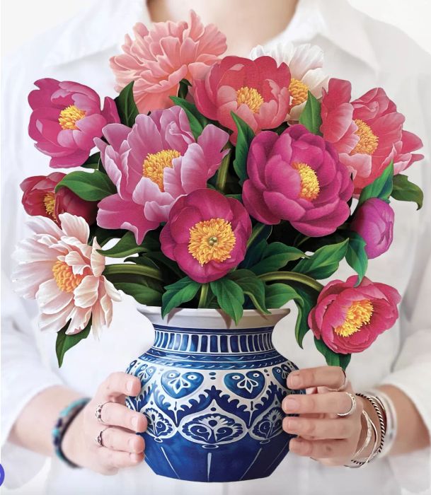 a pop-up bouquet featuring soft pink peonies