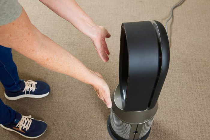 A person experiencing the warmth from the Dyson Purifier Hot+Cool HP07