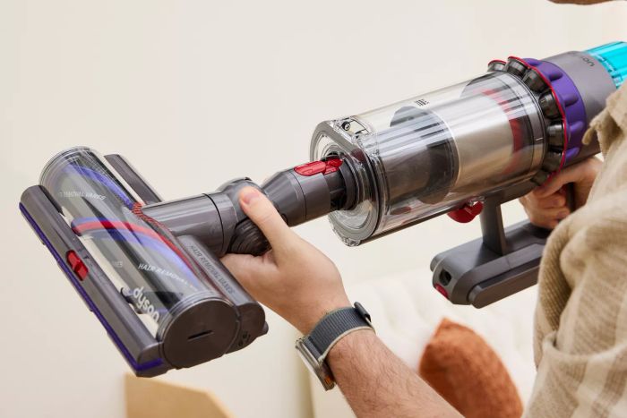 A person putting together the Dyson Gen5detect Cordless HEPA Vacuum.
