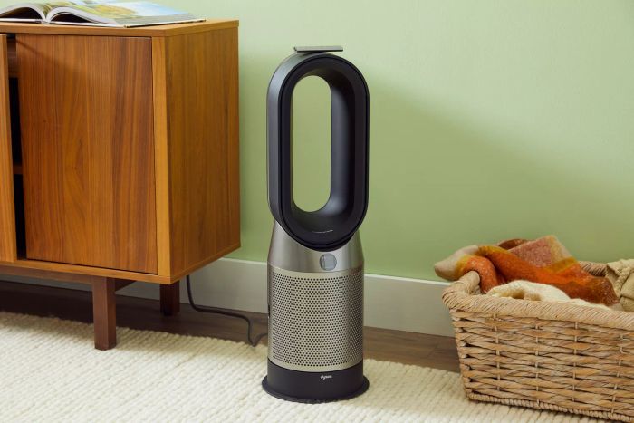 Dyson HP07 Purifier Hot+Cool Purifying Fan Heater placed between a basket and a side table
