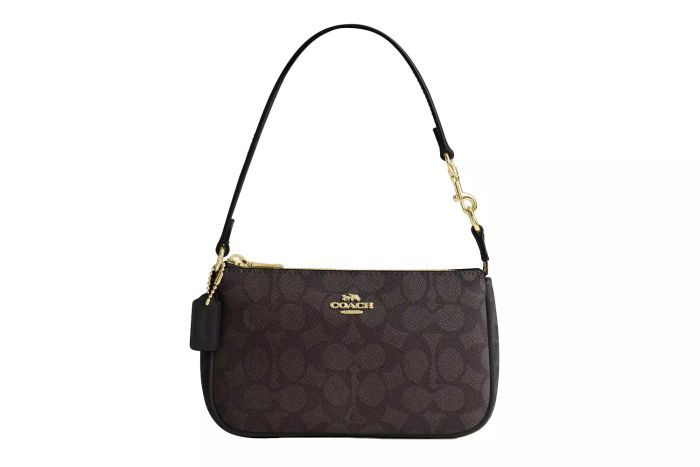 Coach's Nolita 19 in Signature Canvas offers both elegance and versatility, making it a must-have for any fashion enthusiast.