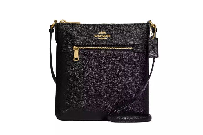 The Coach Mini Rowan File Bag combines style and functionality, perfect for organizing your essentials while keeping a chic appearance.