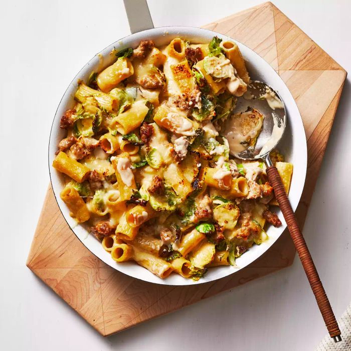 A bowl of cheesy sausage pasta, ready to serve.
