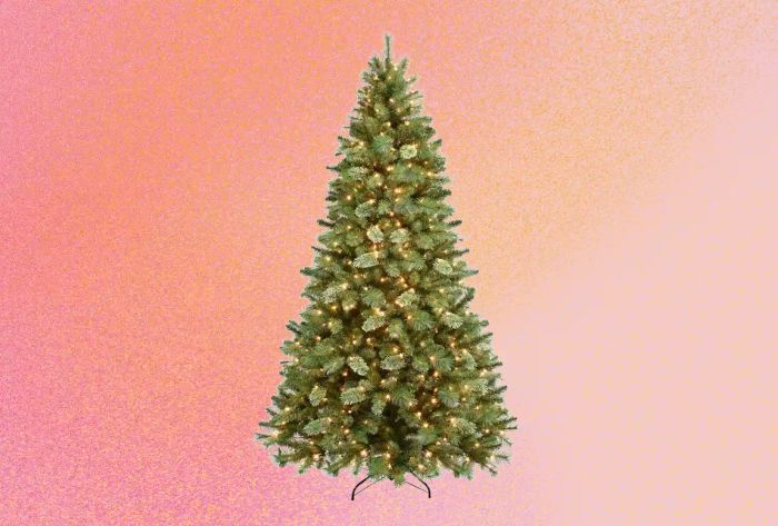 An Artificial Christmas Tree set against a vibrant, colorful backdrop