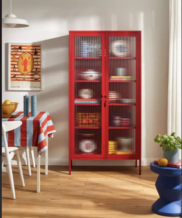 a striking red cabinet in a dining space