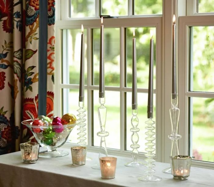 Christmas decorating ideas, Window adorned with holiday decorations and candles