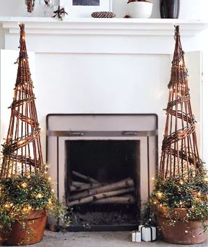 Transform your space with sparkling topiaries placed beside a cozy fireplace for a festive touch.