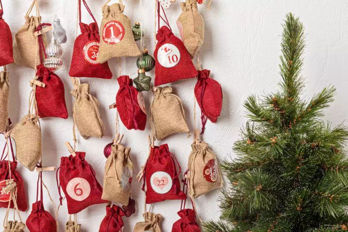 Create a Christmas countdown with an advent calendar made from gift bags hanging on a rope