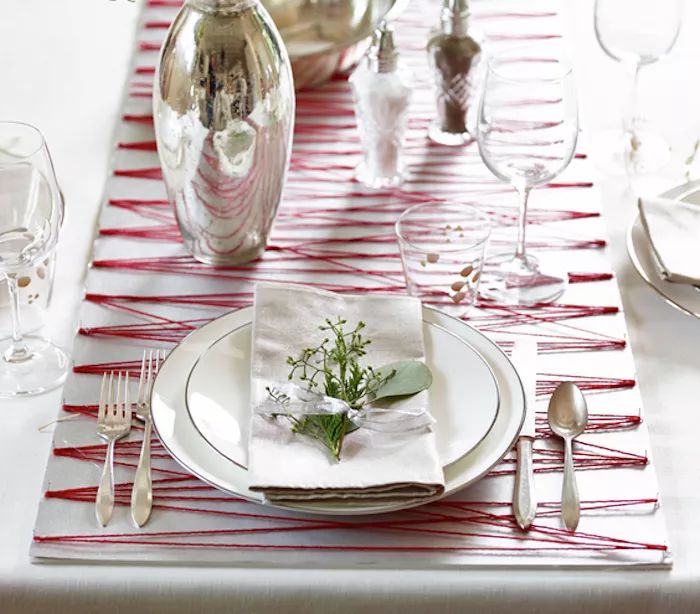 Holiday-themed decorations, including a string and poster board table runner, offer a fun and creative way to style your table for the season.