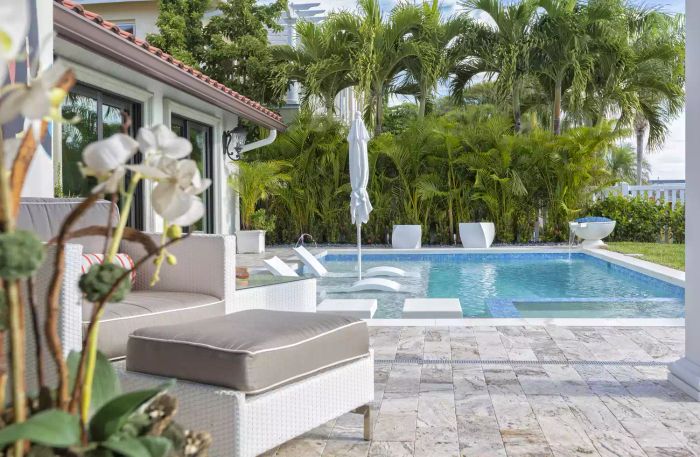 Stunning pool featuring fire pots.